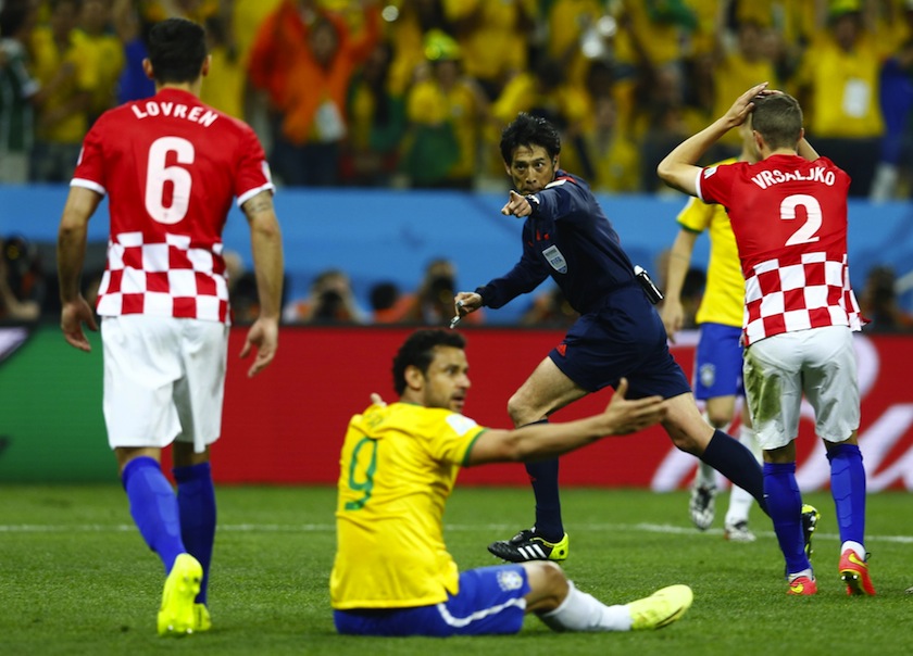 Referee Yuichi Nishimura of Japan gestures for a penalty during the 2014 World Cup opening match between Brazil and Croatia at the Corinthians arena in Sao Paulo June 12, 2014.u00c2u00a0u00e2u20acu201du00c2u00a0Reuters pic