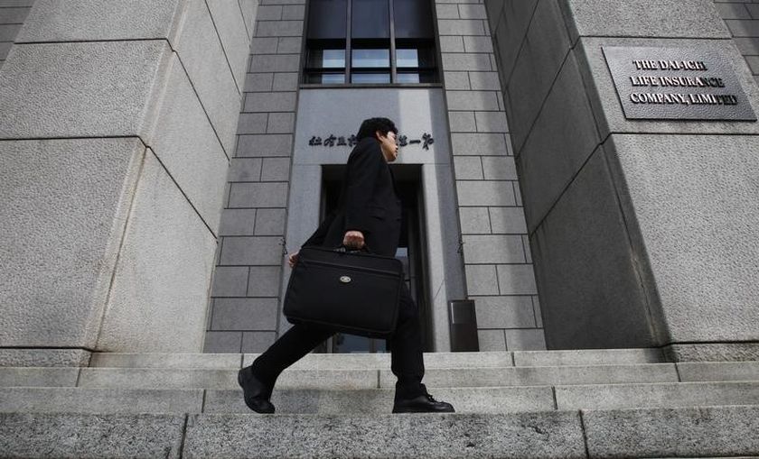 A man walks past Japan's Dai-ichi Life Insurance company headquarters building in Tokyo April 21, 2011. u00e2u20acu201d Reuters pic