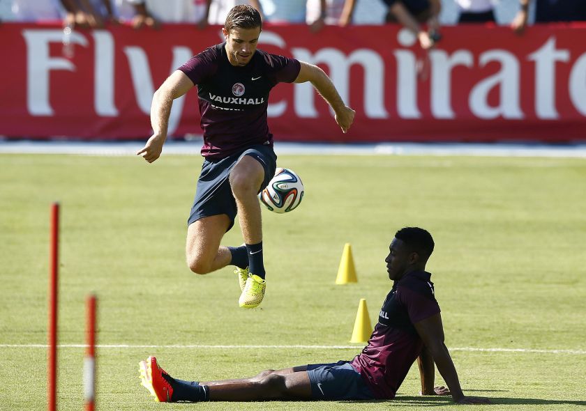 England's Jordan Henderson jumps over Danny Welbeck during a soccer training session ahead of the 2014 World Cup in Rio de Janeiro, June 9, 2014. u00e2u20acu201d Reuters pic