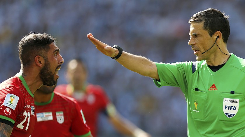 Iranu00e2u20acu2122s Ashkan Dejagah (left) argues with referee Milorad Mazic of Serbia during their 2014 World Cup Group F match against Argentina at the Mineirao stadiumin Belo Horizonte June 21, 2014. u00e2u20acu201d Reuters pic