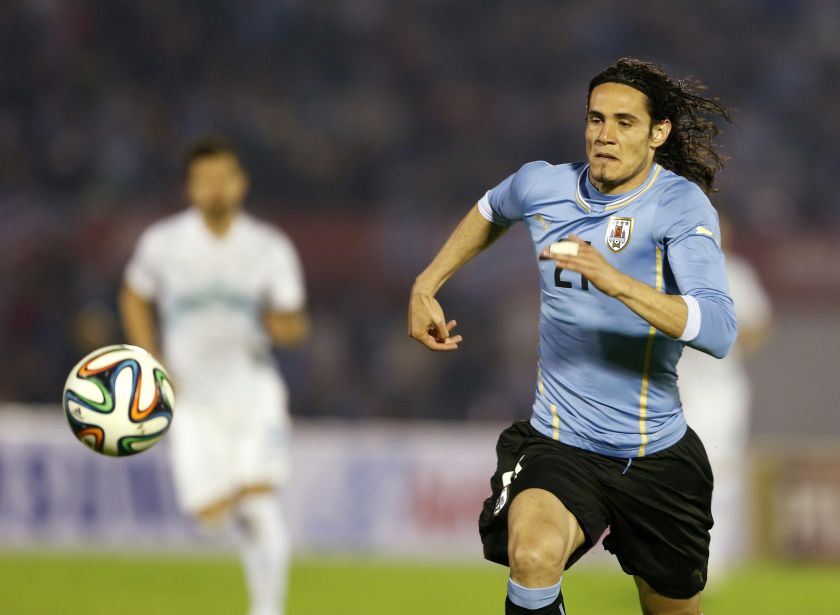 Uruguay's Edinson Cavani goes for the ball during an international friendly football match against Slovenia in Montevideo, June 4, 2014. u00e2u20acu201d Reuters pic