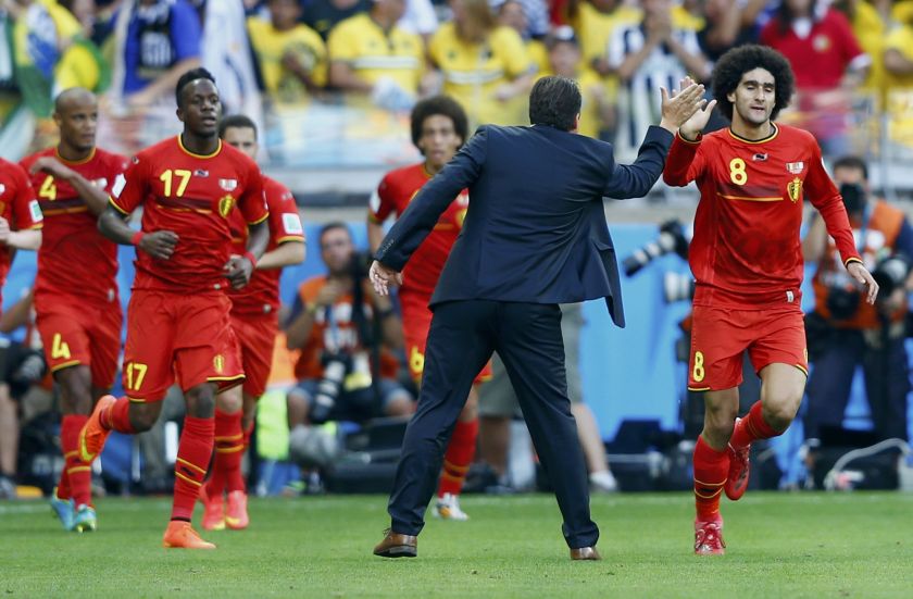 Belgium's Marouane Fellaini (right) celebrates his goal against Algeria with coach Marc Wilmots during their 2014 World Cup Group H football match at the Mineirao stadium in Belo Horizonte June 18, 2014. u00e2u20acu201d Reuters pic