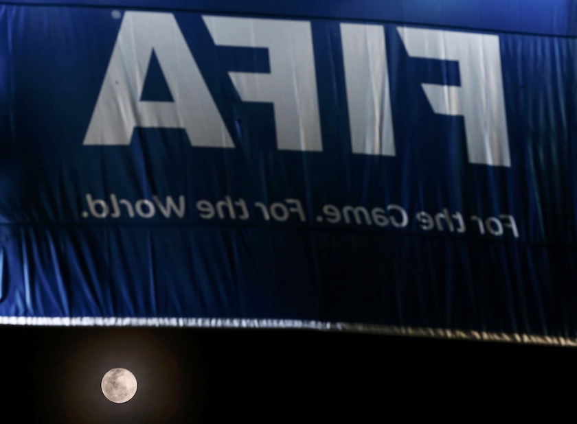 A full moon is seen under a FIFA banner in the Pernambuco Arena stadium before Japan's national team attends a training session in Recife, June 13, 2014.u00c2u00a0u00e2u20acu201d Reuters pic