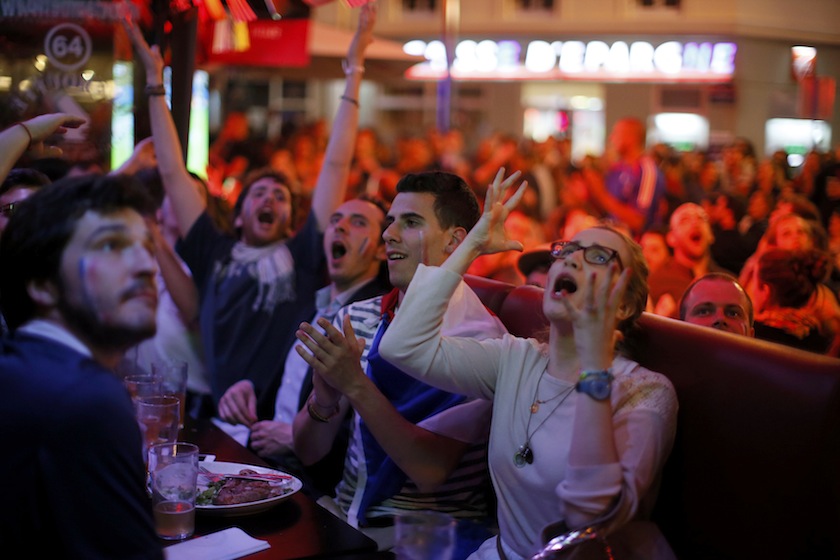 France team fans react during dinner at a cafe as they gather to watch a live broadcast of the 2014 World Cup Group E match between Ecuador and France at the Maracana stadium in Rio de Janeiro, in Paris, June 26, 2014.u00c2u00a0u00e2u20acu201d Reuters pic