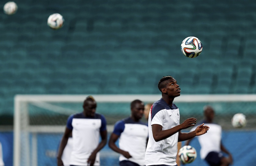 France's Paul Pogba (right) watches the ball during a training session at the Arena Fonte Nova stadium ahead of their 2014 World Cup against Switzerland in Salvador, June 20, 2014. u00e2u20acu201du00c2u00a0Reuters pic