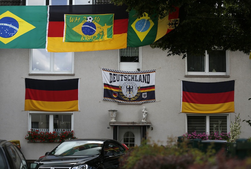 German national flags are seen at a house in Essen June 26, 2014. Germany will play a 2014 World Cup match against the US on June 27. u00e2u20acu201du00c2u00a0Reuters pic