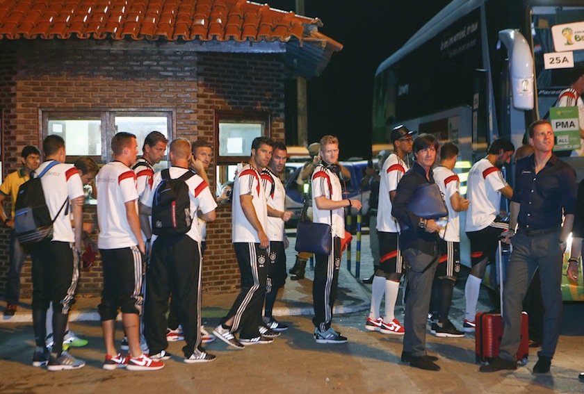Germany's national team coach Joachim Loew and manager Oliver Bierhoff look on as the team boards a bus in the town of Santa Cruz Cabralia, north of Porto Seguro June 20, 2014.u00c2u00a0u00e2u20acu201d Reuters pic