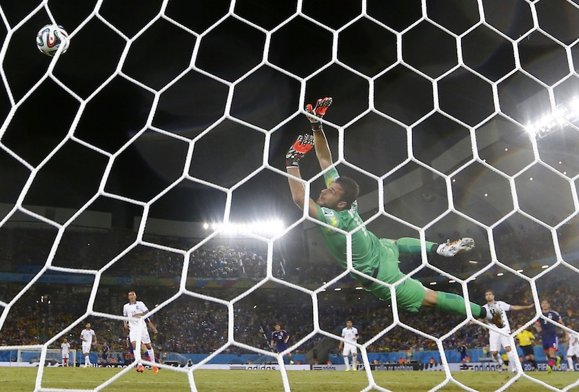Greece's Orestis Karnezis dives as he tries to intercept a missed goal attempt during their 2014 World Cup Group C match against Japan at the Dunas arena in Natal June 20, 2014.u00c2u00a0u00e2u20acu201d Reuters pic
