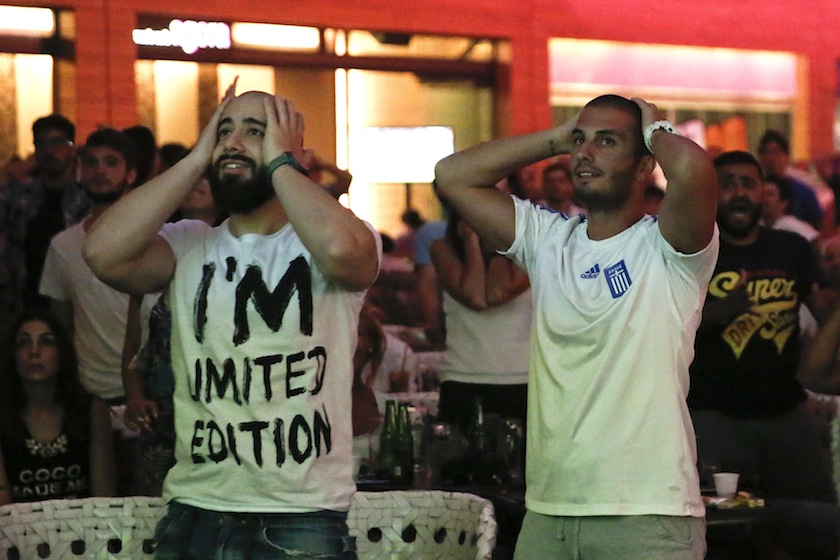 Greek fans react as they watch a live broadcast of Greece's 2014 World Cup match against Costa Rica, in Athens early June 30, 2014. u00e2u20acu201d Reuters pic