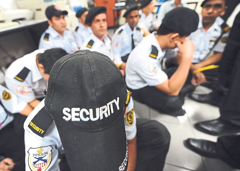 Immigration officers check security personnel during an operation at the Pavilion shopping mall, Kuala Lumpur, on November 7 last year.  u00e2u20acu2022 File pic