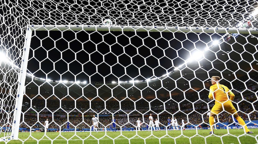 England's Joe Hart (right) watches as the ball from Italy's Andrea Pirlo's freekick hits the crossbar during their 2014 World Cup Group D match at the Amazonia arena in Manaus June 15, 2014.u00c2u00a0u00e2u20acu201d Reuters pic