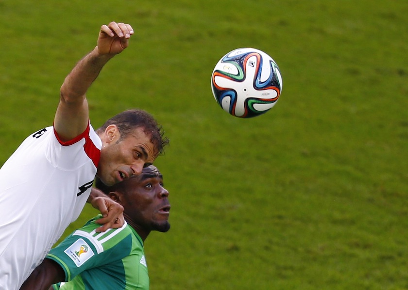 Iran's Jalal Hosseini (left) and Nigeria's Emmanuel Emenike jump for the ball during their 2014 World Cup F match at the Baixada arena in Curitiba June 17, 2014.u00c2u00a0u00e2u20acu201d Reuters pic