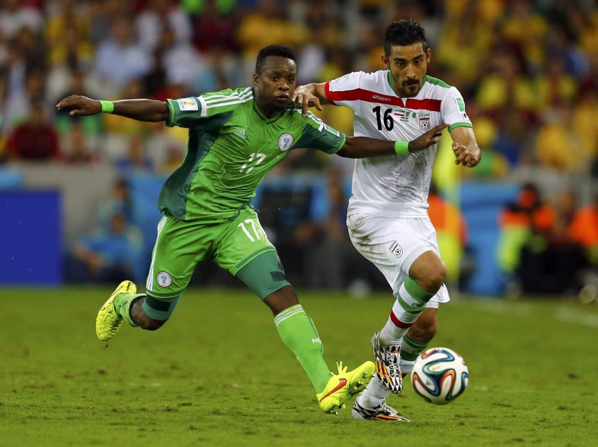 Nigeria's Ogenyi Onazi (left) fights for the ball with Iran's Reza Ghoochannejhad during their 2014 World Cup Group F match at the Baixada arena in Curitiba June 16, 2014. u00e2u20acu2022 Reuters pic