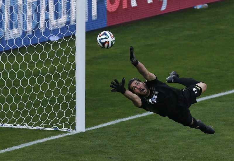 Iran's goalkeeper Alireza Haghighi fails to save a goal by Argentina's Lionel Messi (unseen) at the Mineirao stadium in Belo Horizonte June 21, 2014. u00e2u20acu201d Reuters pic
