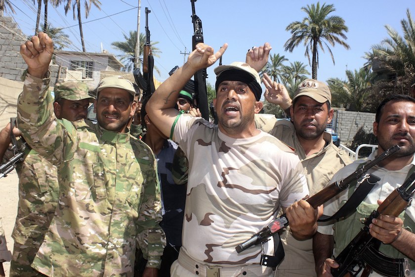 Volunteers carry weapons during a parade in the city of Baquba, June 23, 2014. u00e2u20acu201d Reuters pic