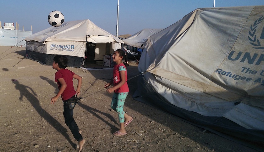 Children, who fled from violence in Mosul, play with a ball inside the Khazer refugee camp on the outskirts of Arbil, in Iraq's Kurdistan region, June 30, 2014.u00c2u00a0u00e2u20acu201d Reuters pic