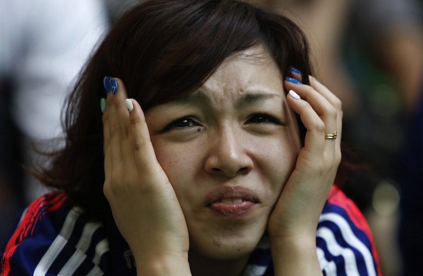 A fan reacts as she watches Japan's 2014 World Cup Group C match against Greece on a big screen during a public viewing event in Tokyo June 21, 2014.u00c2u00a0u00e2u20acu201d Reuters pic