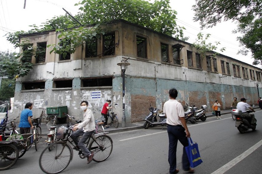 This picture taken on June 18, 2014 shows people walking past a former Japanese military brothel building in Nanjing, east Chinau00e2u20acu2122s Jiangsu province. u00e2u20acu201d AFP pic