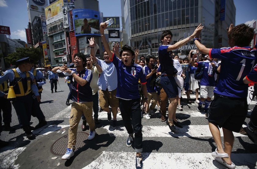 Japanese fans gather at an intersection after their 2014 World Cup match against Ivory Coast, at Shibuya shopping and amusement district in Tokyo June 15, 2014. u00e2u20acu201d Reuters pic