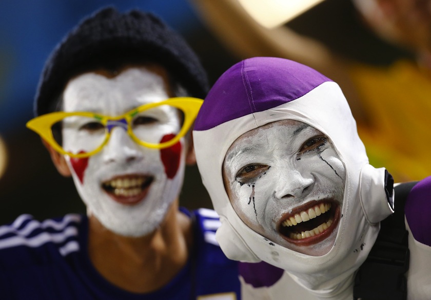 Fans of Greece and Japan pose before the start of the 2014 World Cup Group C match at the Dunas arena in Natal June 20, 2014. u00e2u20acu201d Reuters pic