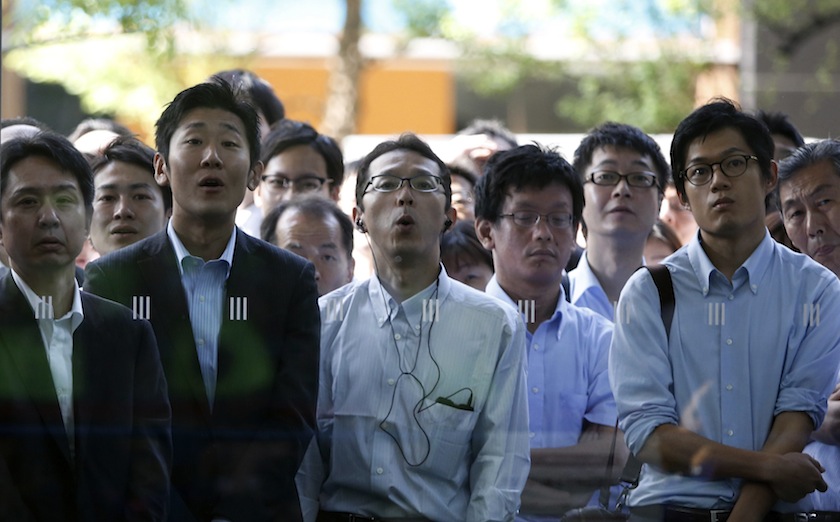 Japan's fans react as they watch the team's 2014 World Cup Group C match against Greece outside a building, during a public viewing event, in Tokyo June 20, 2014. u00e2u20acu201d Reuters pic