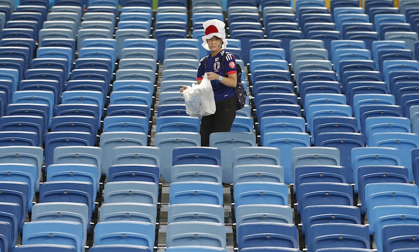 A Japanese fan cleans up the stadium after their 2014 World Cup Group C match against Japan and Greece at the Dunas arena in Natal June 20, 2014.u00c2u00a0u00e2u20acu201d Reuters pic