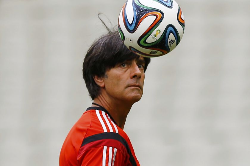 Germany's coach Joachim Loew eyes a ball during a practice session at Castelo stadium in Fortaleza, Brazil June 20, 2014. u00e2u20acu201d Reuters pic