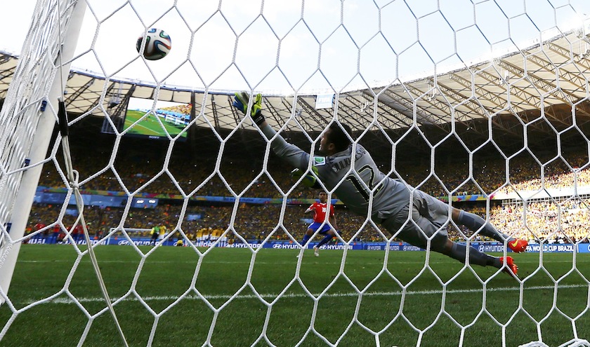 Brazil's goalkeeper Julio Cesar dives as Chile's Gonzalo Jara takes a shot during a penalty shootout, which missed and hit the goal post, in their 2014 World Cup round of 16 game at the Mineirao stadium in Belo Horizonte June 29, 2014.u00c2u00a0u00e2u20acu201du00c2u00a0Reuters pic