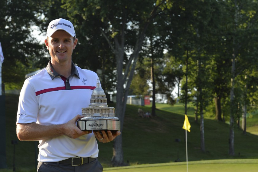 Justin Rose holds the Quicken Loans National trophy up after defeating Shawn Stephani in a one-hole playoff on the 18th green at the Congressional Country Club Blue Course, Washington DC. u00e2u20acu201d Tommy Gilligan-USA TODAY/Reuters pic