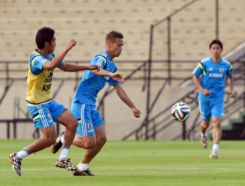 Japanu00e2u20acu2122s forward Keisuke Honda (centre) vies for the ball during their training session at the Estadio Walter Ribeiro in Sorocoba, Sao Paulo, June 8, 2014. u00e2u20acu201d AFP pic