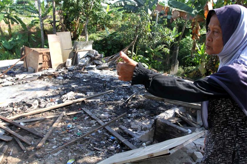 Wahidah Md Salleh,73 pinting to where her house used to stand before it was demolished by DBKL. u00e2u20acu201d Picture by Yusof Mat Isa