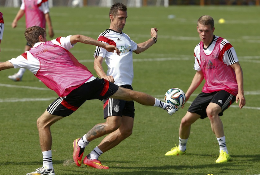 Germany's national player Miroslav Klose is challenged by Christoph Kramer (left) and Matthias Ginter (right) during a training session of the German team in the village Santo Andre near Porto Seguro June 9, 2014.u00c2u00a0u00e2u20acu201d Reuters pic
