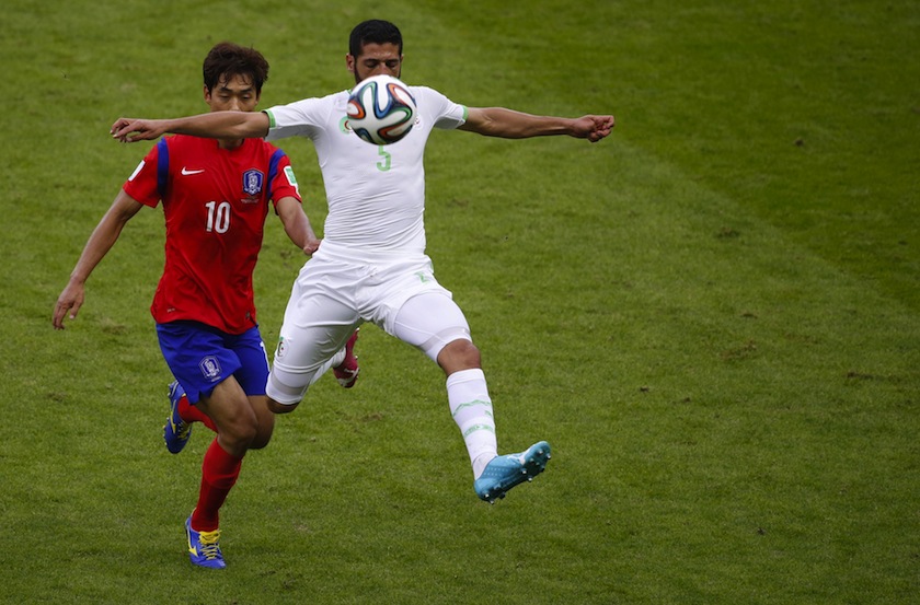 South Korea's Park Chu-young (left) fights for the ball with Algeria's Rafik Halliche during their 2014 World Cup Group H match at the Beira Rio stadium in Porto Alegre June 23, 2014.u00c2u00a0u00e2u20acu201d Reuters pic