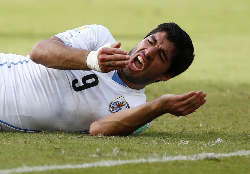Uruguayu00e2u20acu2122s Luis Suarez reacts after clashing with Italyu00e2u20acu2122s Giorgio Chiellini during their 2014 World Cup Group D match at the Dunas arena in Natal June 24, 2014. u00e2u20acu201d Reuters pic