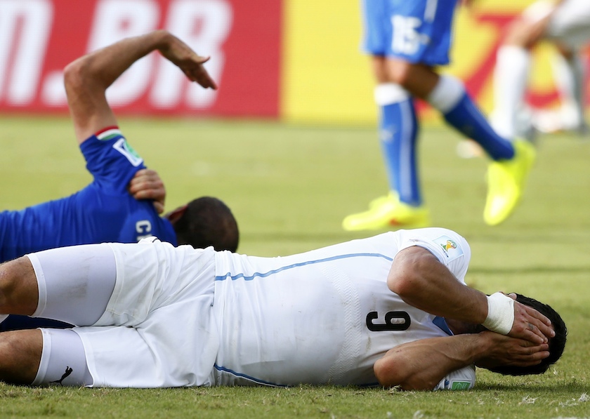 Uruguayu00e2u20acu2122s Luis Suarez reacts after clashing with Italyu00e2u20acu2122s Giorgio Chiellini during their 2014 World Cup Group D match at the Dunas arena in Natal June 24, 2014. u00e2u20acu201d Reuters pic