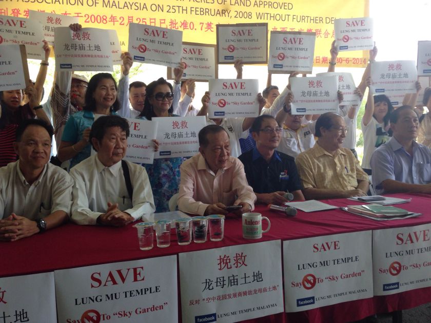Lung Mu temple devotees and the Federation of Kwong Siew Association Of Malaysia representatives protesting against the development that threatens to encroach into temple grounds . u00e2u20acu201d Picture by Melissa Chi