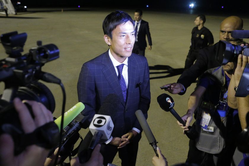 Japan's national soccer team player Makoto Hasebe talks to the media as he arrives at the Viracopos airport ahead of the 2014 World Cup in Campinas June 7, 2014. u00e2u20acu201d Reuters pic