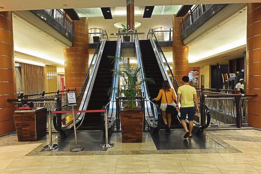 The escalator (left), from where Nurul Emielda was said to have lost her balance and fallen, is sealed off. u00e2u20acu201d Picture by Azinuddin Ghazali