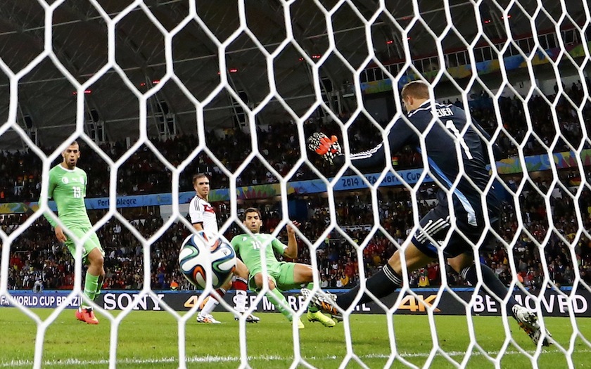 Algeria's Abdelmoumene Djabou scores past Germany's goalkeeper Manuel Neuer during their 2014 World Cup round of 16 game at the Beira Rio stadium in Porto Alegre July 1, 2014.u00c2u00a0u00e2u20acu201d Reuters pic
