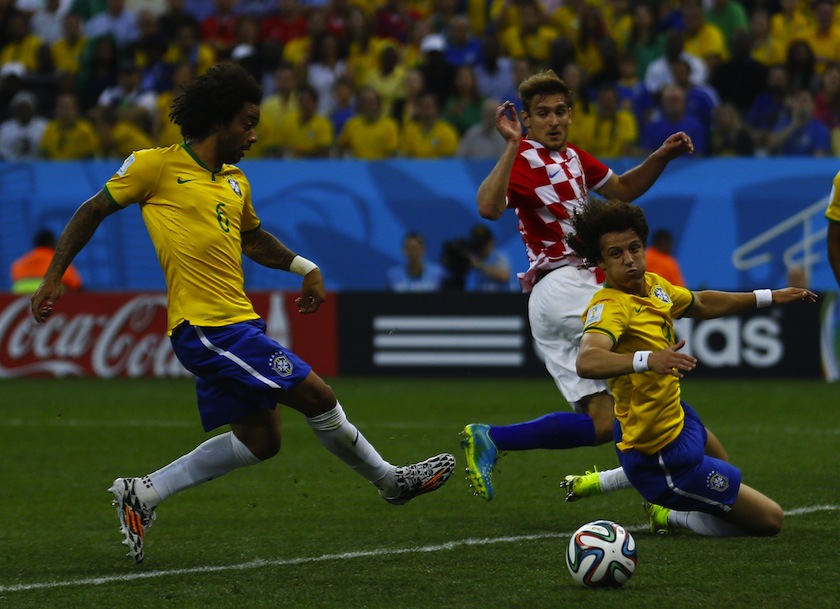 Brazil's Marcelo scores an own goal as Croatia's Nikica Jelavic and Brazil's David Luiz look on during the 2014 World Cup opening match between Brazil and Croatia at the Corinthians arena in Sao Paulo June 12, 2014. u00e2u20acu201d Reuters pic