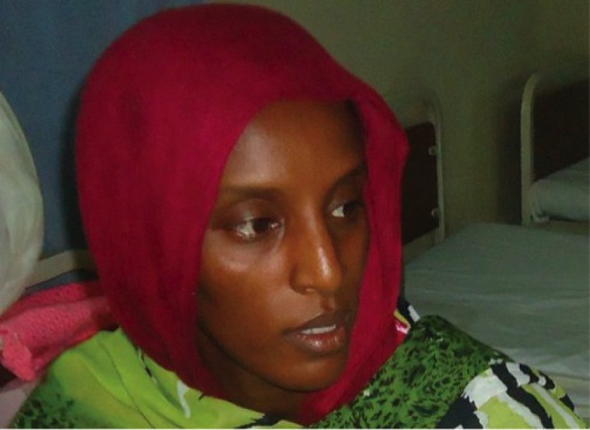 A file picture taken on May 28, 2014 shows Meriam Yahia Ibrahim Ishag, a 27-year-old Christian Sudanese woman sentenced to hang for apostasy, siting in her cell a day after she gave birth to a baby girl at a women's prison in Khartoum's twin city of Omdur