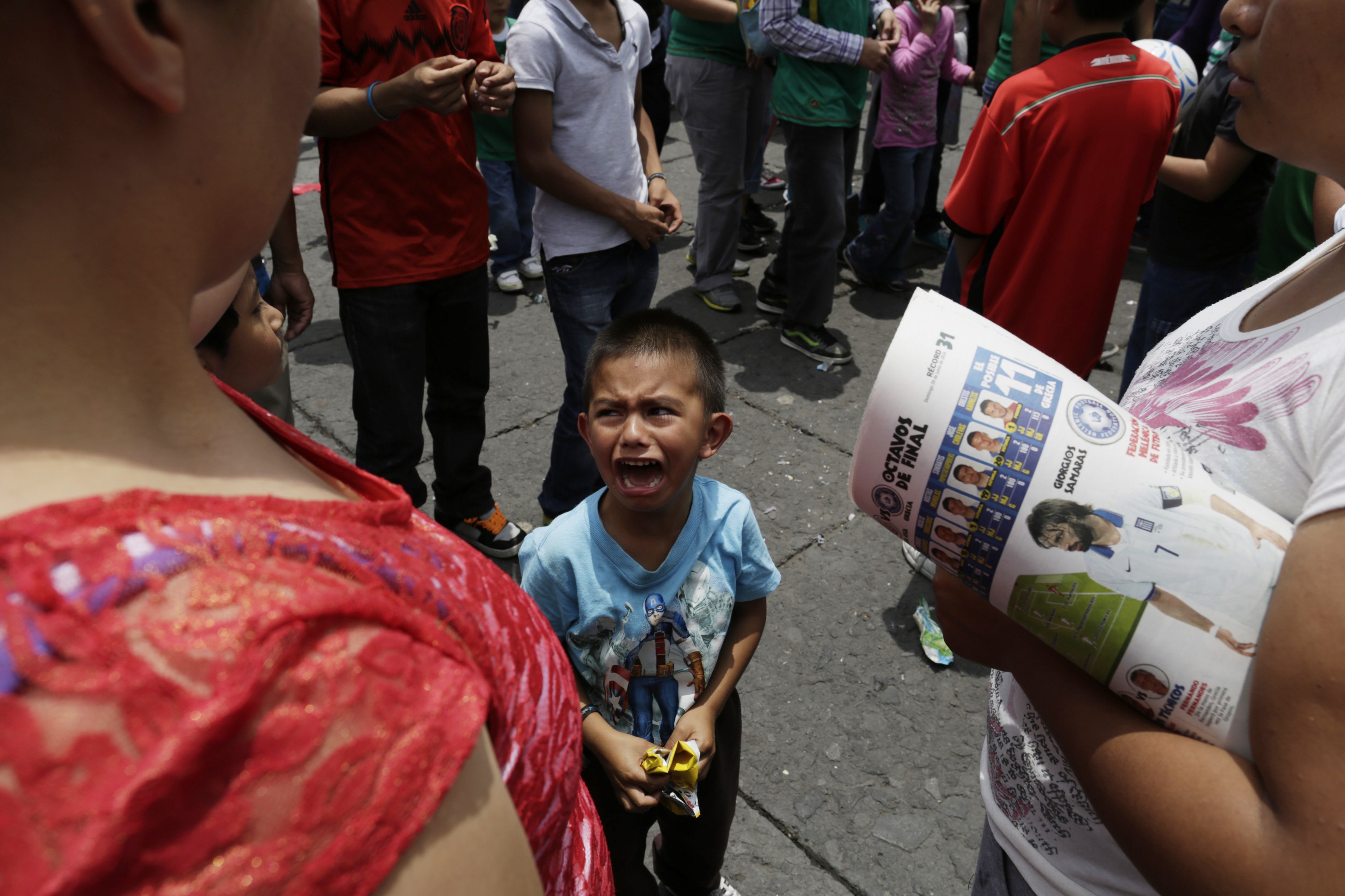 A young Mexican fan cries after the 2014 World Cup soccer match between Mexico and Netherlands during a public viewing at the Zocalo square in downtown Mexico City June 30, 2014.u00c2u00a0u00e2u20acu201du00c2u00a0Reuters pic
