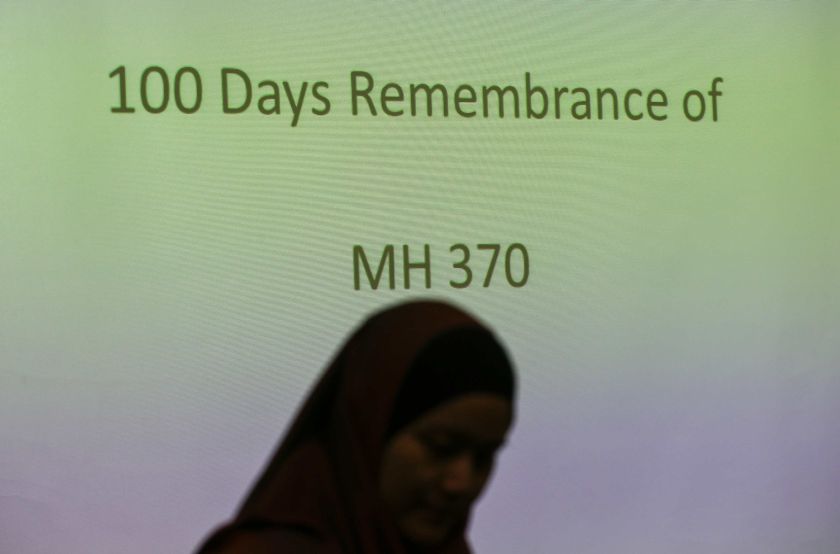 A family member of a Malaysian passenger on board the missing Malaysia Airlines Flight 370 stands during the 100 Days Remembrance of MH370 in Kuala Lumpur June 15, 2014. u00e2u20acu201d Reuters pic