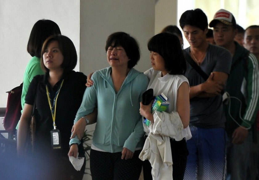 File picture of March 25, 2014 shows family members of passengers of flight MH370 walking across the forecourt of Hotel Bangi-Putrajaya. u00e2u20acu201d Bernama pic