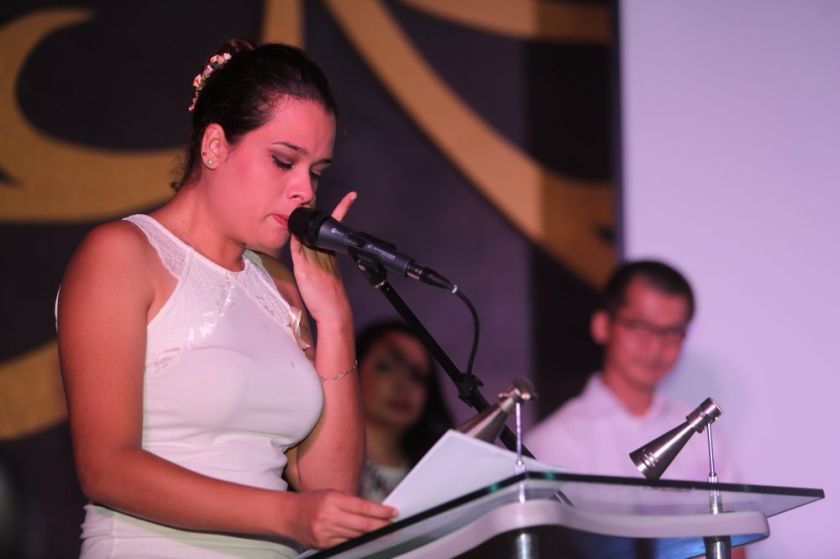 A family member of Flight MH370 crew reads a poem at a fund-raising dinner organised by NUFAM at Hotel Empire Subang, June 7, 2014. u00e2u20acu201d Picture by Choo Choy May