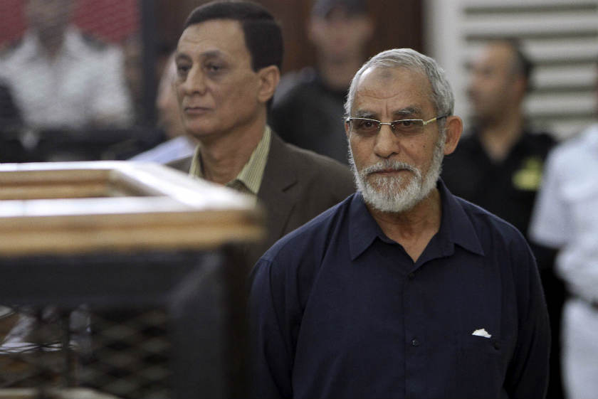 Muslim Brotherhood's Supreme Guide Mohamed Badie (right) looks on during his trial at a court in Cairo, in this May 18, 2014 Reuters file photo. u00e2u20acu201d Reuters pic