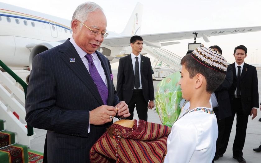 Prime Minister Datuk Seri Najib Razak has a taste of the u00e2u20acu02dcChoreku00e2u20acu2122 bread, a symbol of Turkmenistan hospitality, as soon as he touched down at the Ashgabat airport on his two-day official visit to Turkmenistan, June 10, 2014. u00e2u20acu2022 Bernama pic