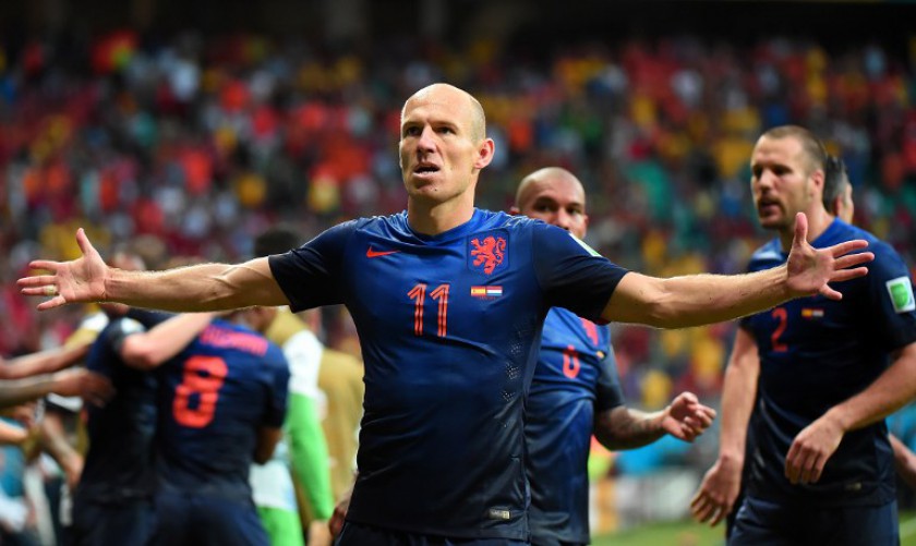 Netherlandsu00e2u20acu2122 forward Arjen Robben (centre) celebrates after scoring a goal during a World Cup Group B match between Spain and the Netherlands in Salvador on June 13, 2014. u00e2u20acu201d AFP pic