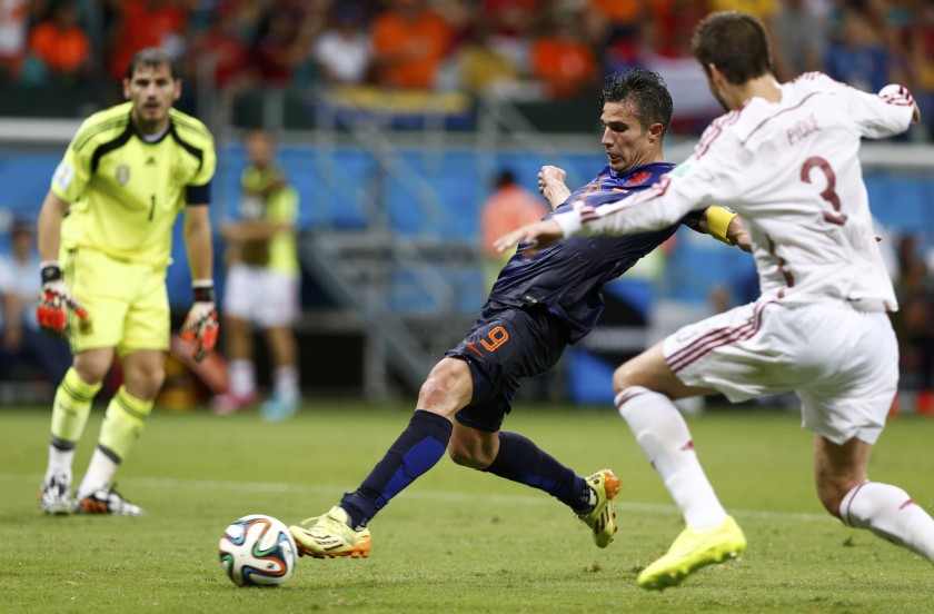 Robin van Persie of the Netherlands shoots to score his team's fourth goal against Spain during their 2014 World Cup Group B match at the Fonte Nova arena in Salvador June 13, 2014. u00e2u20acu201d Reuters pic