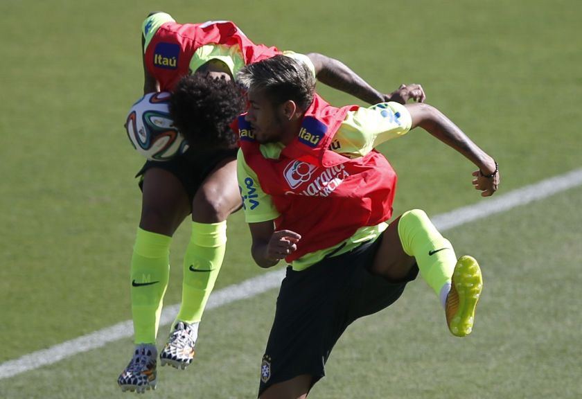 Brazil's national football players Neymar (right) and Marcelo attend a training session in Belo Horizonte June 28, 2014. u00e2u20acu201d Reuters pic